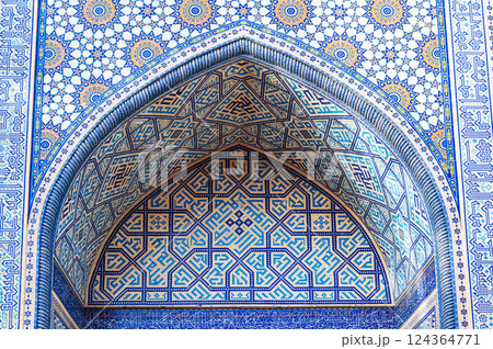 arch of a Muslim mosque decorated with ceramic tiles with a traditional Uzbek oriental pattern in Tashkent in Uzbekistan 124364771
