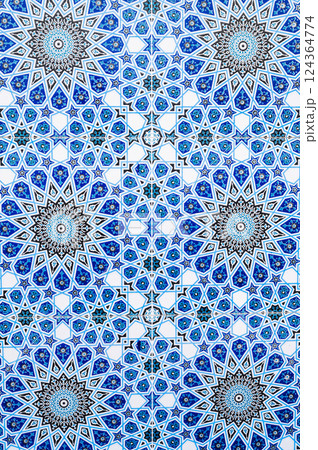 ceramic tiles with traditional Uzbek oriental pattern in Uzbekistan. Blue decorative background with Islamic ornament ceramic tiles with traditional Uzbek oriental pattern in Uzbekistan. Blue decorative background with Islamic ornament 124364774