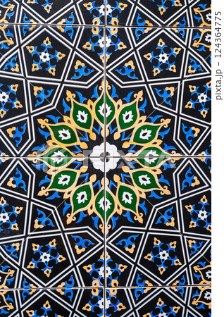 ceramic tiles with traditional Uzbek oriental pattern in Uzbekistan. Decorative floral background with Islamic ornament 124364775