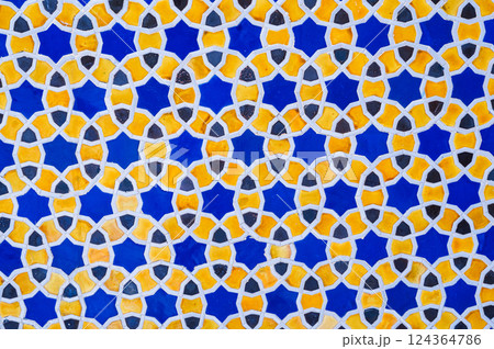 yellow and blue ceramic tiles with an abstract geometric pattern. Background with uzbek ornament 124364786