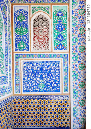 beautiful carved wooden painted wall in Museum of Art of Uzbekistan with traditional Uzbek ornaments and oriental patterns in Tashkent 124364789