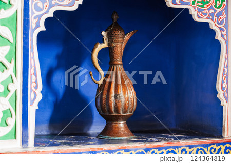 antique traditional Uzbek brass jug on exhibition at Museum of Antiques in Tashkent in Uzbekistan antique traditional Uzbek brass jug on exhibition at Museum of Antiques in Tashkent in Uzbekistan 124364819