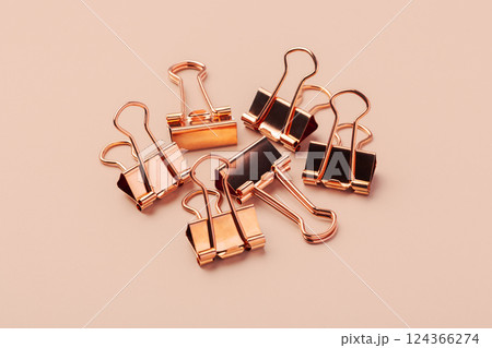 Heap of copper gold binder paper clips mockup 124366274