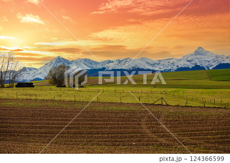 Mountains landscape in autumn. View of arable fields in the valley and mountain ridge covered with snow during sunset, Pyrenees, Andorra, Europe 124366599