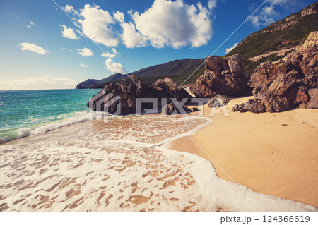 Rocky seascape on a sunny day, view of sunny bay. Galapinhos beach, Setubal, Portugal 124366619