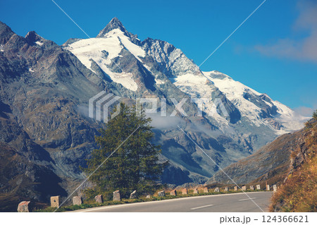 Mountain landscape. Mountain road and blue sky. Grossglockner High Alpine Road. Austria, Europe Mountain landscape. Mountain road and blue sky. Grossglockner High Alpine Road. Austria, Europe 124366621