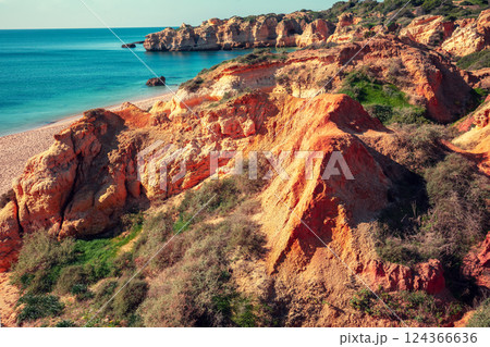 Rocky seashore. View of Praia da Marinha beach in the Algarve region in the Atlantic ocean, Portugal, Europe Rocky seashore. View of Praia da Marinha beach in the Algarve region in the Atlantic ocean, Portugal, Europe 124366636