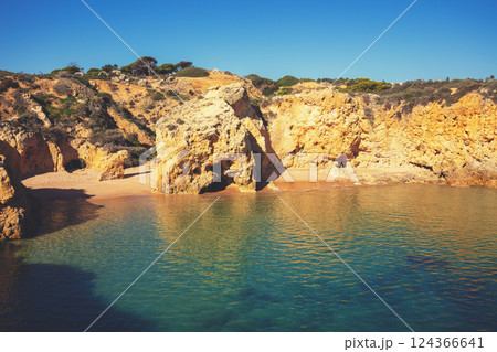 Coastal rocky seascape, view of Praia da Marinha beach in Algarve region in Atlantic ocean, Portugal, Europe 124366641