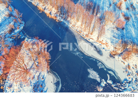 Aerial view of a narrow river on a sunny winter day 124366683