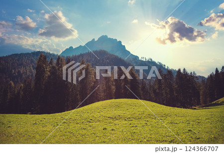 Mountain landscape background. Rocks against the day sky. The Dolomites in South Tyrol, Italy, Europe Mountain landscape background. Rocks against the day sky. The Dolomites in South Tyrol, Italy, Europe 124366707