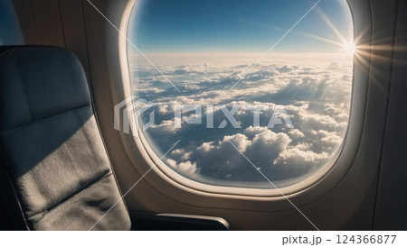 airplane seat by the window with a view of white clouds airplane seat by the window with a view of white clouds 124366877