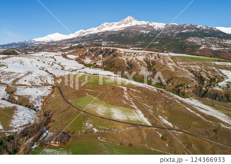 View from above of mountains near  Serre-Poncon lake in winter Hautes Alpes, France 124366933