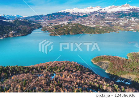 Mountain lake in autumn Aerial view. Serre-Poncon mountain lake in winter in Hautes Alpes, France 124366936