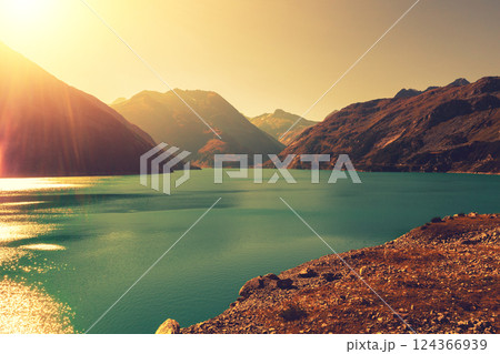 View of a mountain lake in autumn at sunset. Kolnbrein storage facility (Kolnbreinspeicher), Austria, Europe 124366939