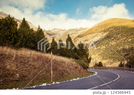 Sharp turn. Driving on a winding mountain road in the Pyrenees, Andorra, Europe. 124366945