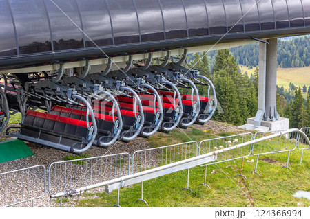 Summer chair lift, many cabins waiting for the season Summer chair lift, many cabins waiting for the season 124366994
