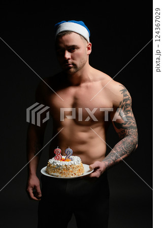 Celebrating a milestone birthday with a festive cake and athletic flair 124367029