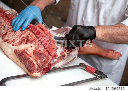 Piece of pork on a butcher stall 124369213