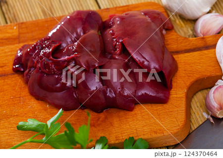 Raw rabbit liver with natural ingredients before cooking Raw rabbit liver with natural ingredients before cooking 124370464