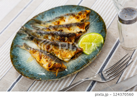 Grilled sardines with lime for Mediterranean styled meal 124370560