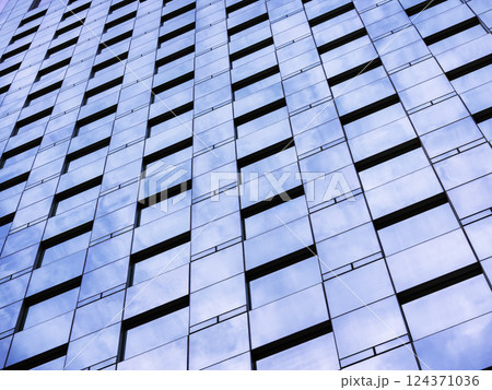 Glass wall Modern building facade Sky reflection perspective Architecture details 124371036