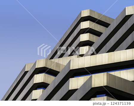 Geometric building Metal facade exterior gradation level Architecture details Geometric building Metal facade exterior gradation level Architecture details 124371139
