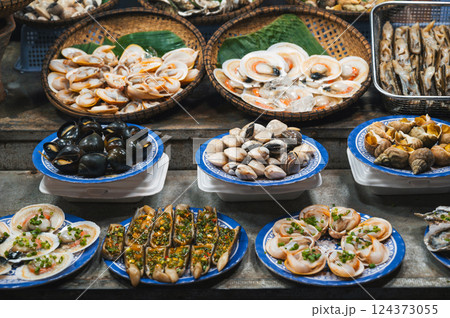 Snails and clams at Asian Seafood Street food night market in Vietnam. Vietnamese traditional food 124373055