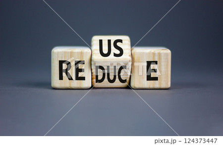 Reuse or reduce symbol. Concept words Reuse Reduce on wooden block. Beautiful grey table grey background. Business reuse or reduce concept. Copy space. 124373447