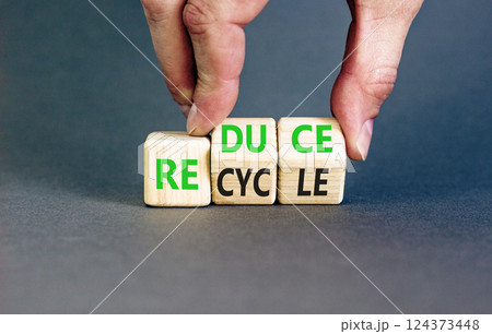 Reduce or recycle symbol. Concept words Reduce Recycle on wooden block. Beautiful grey table grey background. Businessman hand. Business reduce or recycle concept. Copy space. Reduce or recycle symbol. Concept words Reduce Recycle on wooden block. Beautiful grey table grey background. Businessman hand. Business reduce or recycle concept. Copy space. 124373448