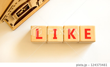 Like symbol. Concept word Like on beautiful wooden blocks. Beautiful wooden house. Beautiful white table white background. Business, lifestyle, support and like concept. Copy space. Like symbol. Concept word Like on beautiful wooden blocks. Beautiful wooden house. Beautiful white table white background. Business, lifestyle, support and like concept. Copy space. 124373481