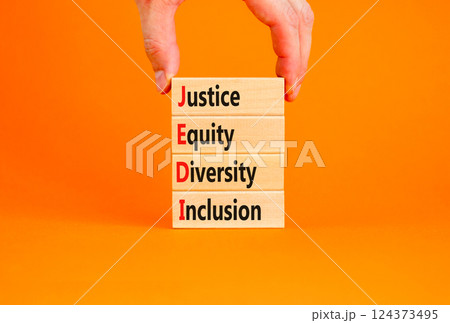 Justice equity diversity inclusion symbol. Concept words JEDI Justice Equity Diversity Inclusion on blocks. Beautiful orange background. Business justice equity diversity inclusion concept. Copy space 124373495
