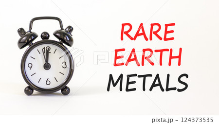 Rare earth metals symbol. Concept words Rare earth metals on beautiful white paper. Alarm clock. Beautiful white paper background. Business and rare earth metals concept. Copy space. 124373535