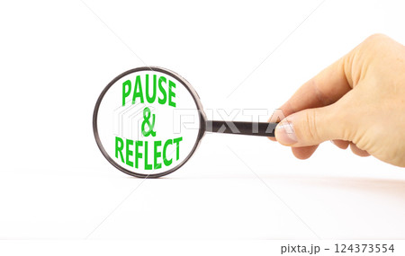 Pause and reflect symbol. Concept words Pause and reflect in beautiful magnifying glass. Beautiful white background. Business motivational lifestyle pause and reflect concept. Copy space. Pause and reflect symbol. Concept words Pause and reflect in beautiful magnifying glass. Beautiful white background. Business motivational lifestyle pause and reflect concept. Copy space. 124373554