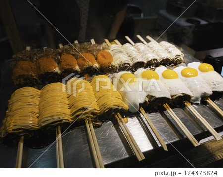 Japanese food grill okonomiyaki with topping Street food Japan cuisine 124373824