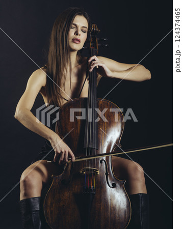 Attractive cello player playing her instrument 124374465