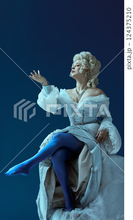 Dramatic poise. Medieval elegant woman in white dress lifts leg mid-gesture with expressive flair, frozen in noble confidence 124375210