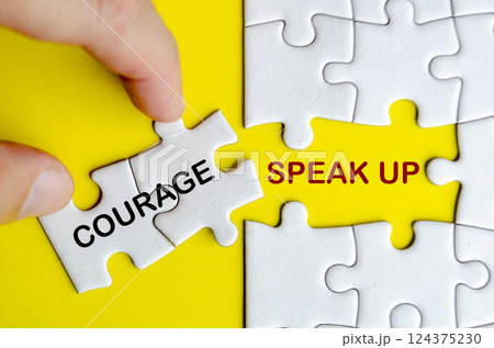 Courage to Speak Up text on missing jigsaw puzzle. Courage to speak up concept 124375230