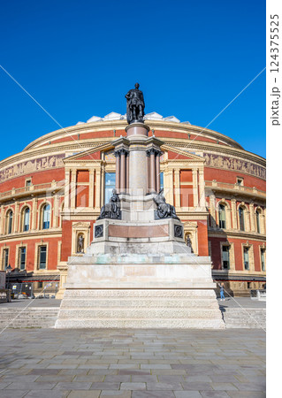 This outdoor monument honors Albert, Prince Consort, commemorating the Great Exhibition of 1851. Located south of Royal Albert Hall, it showcases intricate design against a clear blue sky. This outdoor monument honors Albert, Prince Consort, commemorating the Great Exhibition of 1851. Located south of Royal Albert Hall, it showcases intricate design against a clear blue sky. 124375525