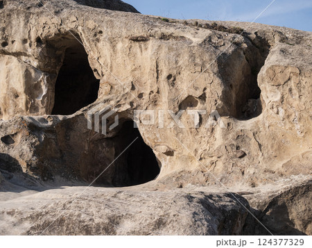 Uplistsikhe, Georgia, Unique rock formations reveal ancient caves under clear skies 124377329
