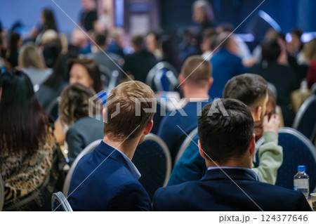 Audience members attending a professional conference at a business event Audience members attending a professional conference at a business event 124377646