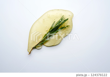 A drop of rosemary cosmetic product. 124378122