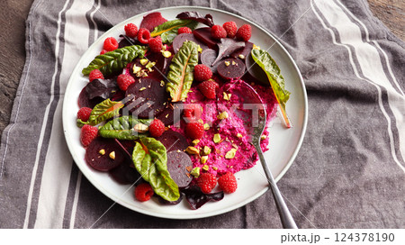 Healthy Beet Salad with raspberry, red pray, nuts  124378190