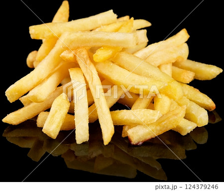Golden Crispy French Fries on reflective Black Background 124379246