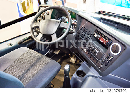 Driver seat and steering wheel with dashboard of bus 124379592