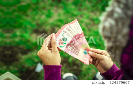 woman hands counting banknotes. Nicaraguan 500 cordobas banknotes woman hands counting banknotes. Nicaraguan 500 cordobas banknotes 124379667