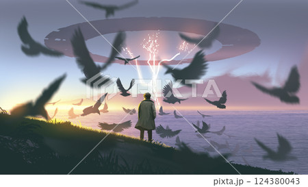 A mysterious man watches the sky shift above the ocean 124380043