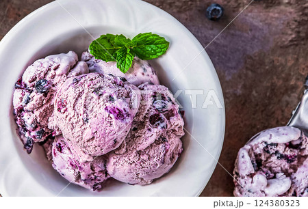 Blueberry homemade ice cream on stone slate background 124380323