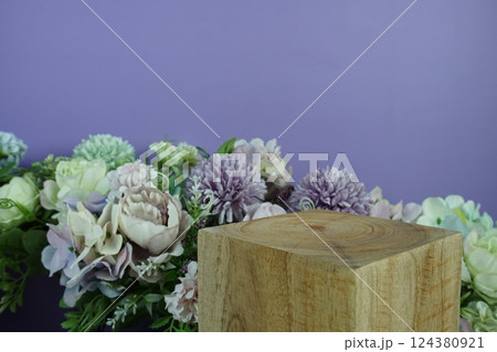 Wooden podium display scene stage showcase front view with copy space and flowers decoration on purple background 124380921