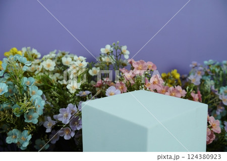 Wooden podium display scene stage showcase front view with copy space and flowers decoration on purple background 124380923