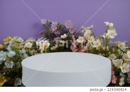 Wooden podium display scene stage showcase front view with copy space and flowers decoration on purple background 124380924